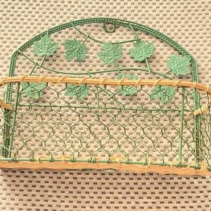 Hanging wicker and metal basket. 12” wide/10” tall and basket is 4” deep.